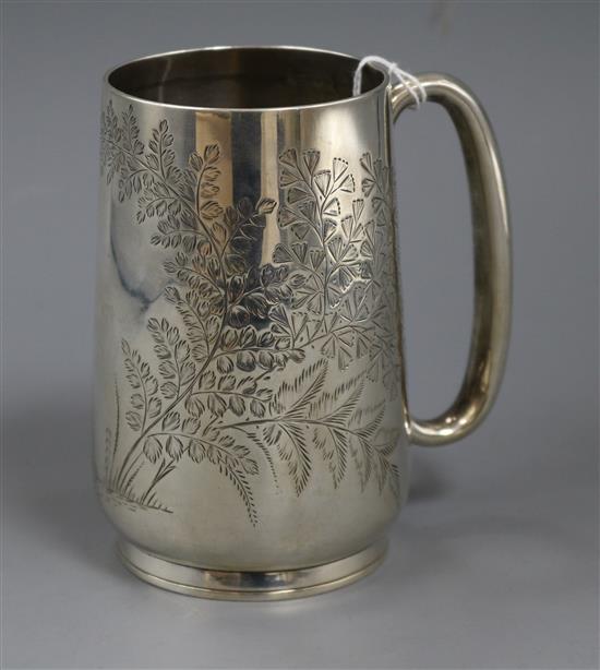 A Victorian provincial silver mug, engraved with foliage, Josiah Williams & Co, Exeter, circa 1880, 7 oz.